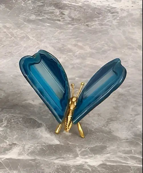 Blue translucent glass butterfly pin with gold-toned metal body from decorbites agate butterfly ornament set brass decor