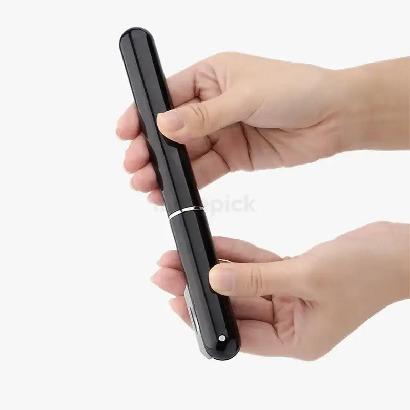 A black sleek compact hair straightener with silver accent band and rounded ends shown with decorbites air pump corkscrew kit