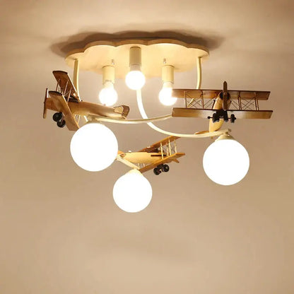 Decorbites wooden airplane chandelier light with three spherical bulbs and cloud-shaped base for nursery room ceiling