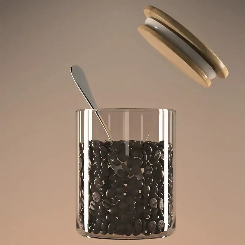 Decorbites airtight glass coffee bean storage jar with clear glass body bamboo lid and silver spoon inside