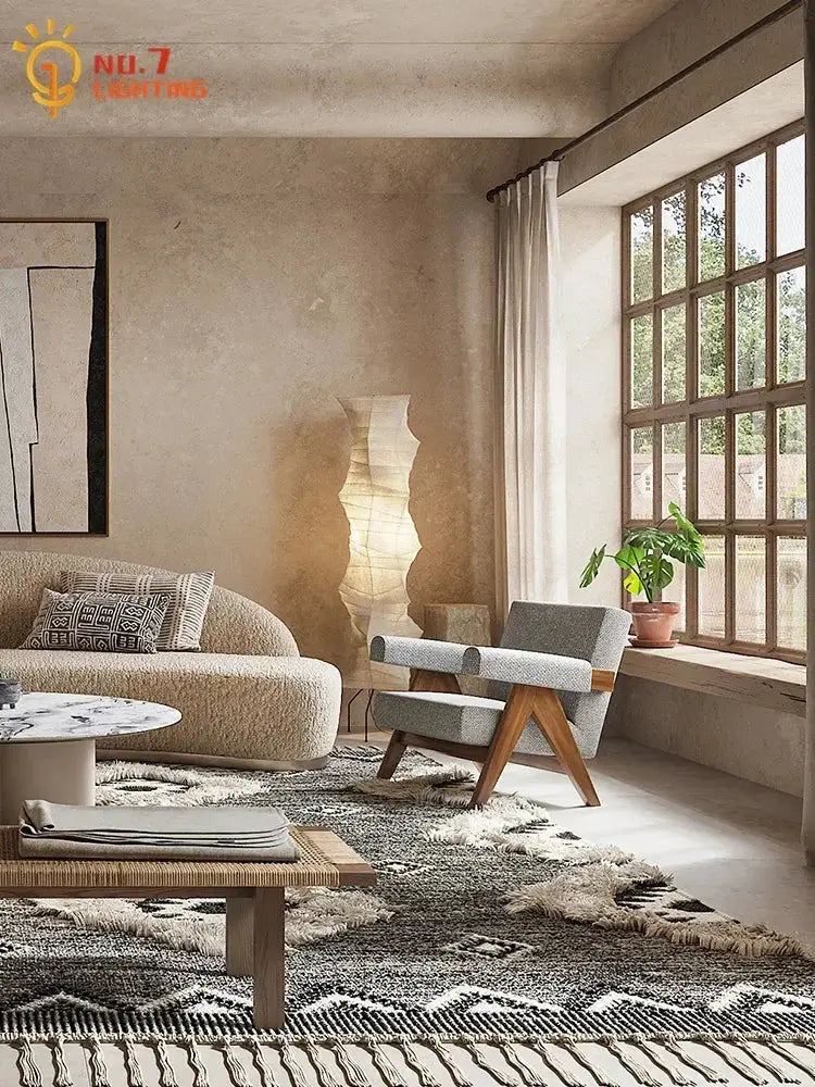 Beige textured sofa with geometric throw pillows next to decorbites akari japanese rice paper floor lamp for living room