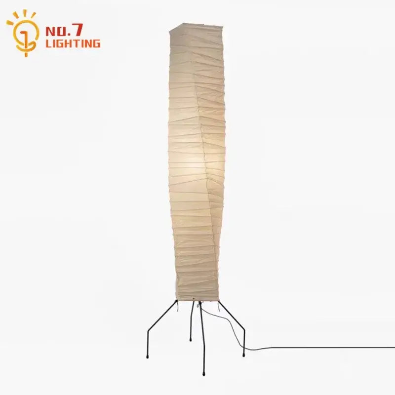 Tall beige decorbites™ akari noguchi floor lamp with minimalist rice paper shade and black metal tripod base for living room