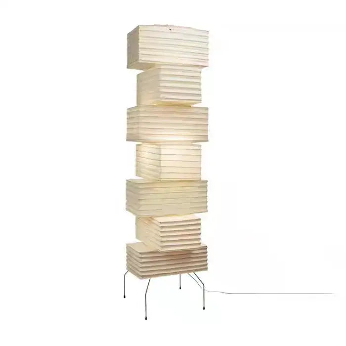 Cream-colored akari noguchi floor lamp with stacked paper sections and minimalist metal base for living room decor