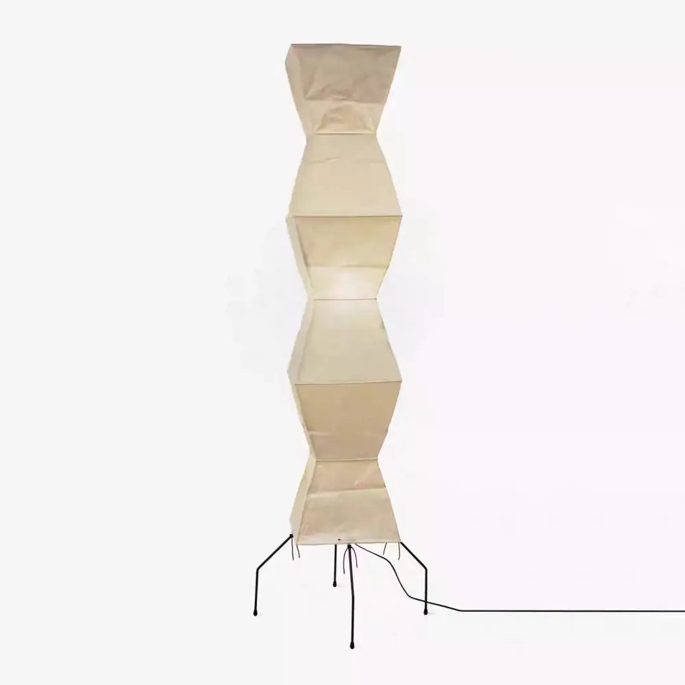 Beige akari noguchi floor lamp with segmented geometric rice paper shade and black metal legs for living room decor