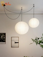 Two spherical white paper pendant lights by decorbites akari noguchi led hang from ceiling for living room decor