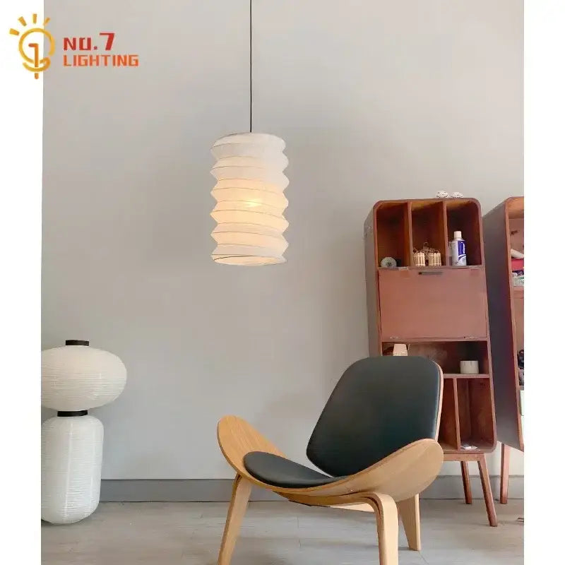 White layered paper pendant light with a modern spiral design in the DecorBites™ Akari Noguchi pendant collection