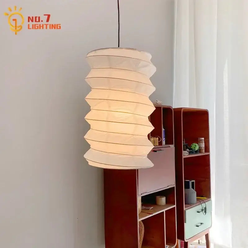 A cream-colored retro rice paper akari noguchi pendant light with a spiral design for home décor by decorbites