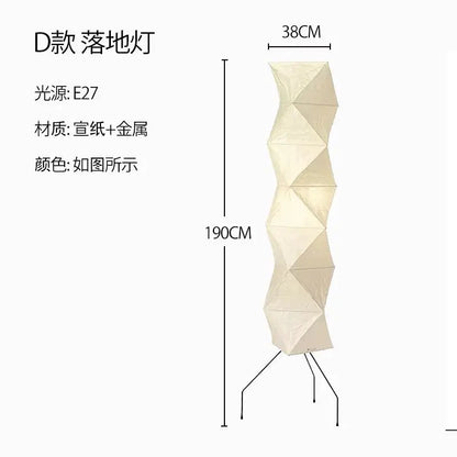 A tall cream-colored DecorBites Akari Noguchi floor lamp made of rice paper and metal for living room lighting