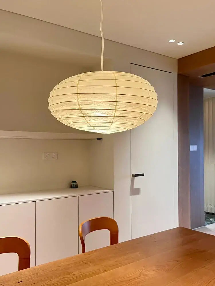 Decorbites akari noguchi rice paper pendant light with warm glow and segmented spherical design for bedroom use