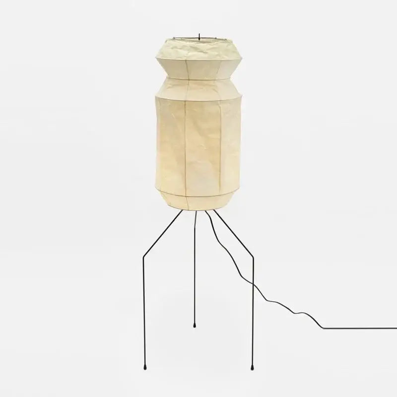 Cream-colored decorbites akari noguchi rice paper table lamp with LED E27 bulb and black metal tripod base for living room