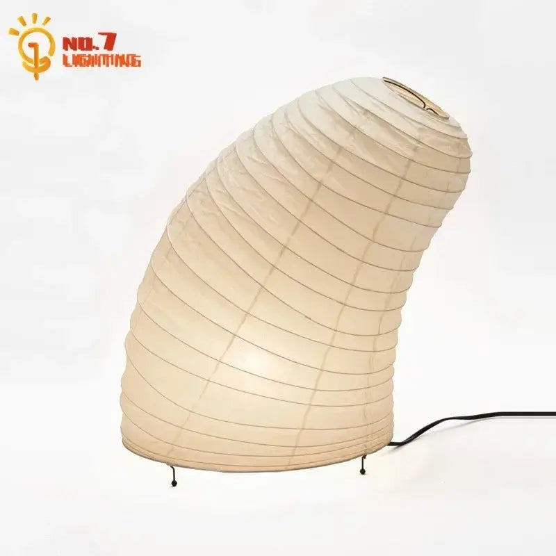 Cream-colored decorbites akari noguchi rice paper table lamp with curved design and black metal legs for living room