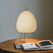 DecorBites™ akari noguchi table lamp with warm-toned egg-shaped rice paper shade and black metal tripod base