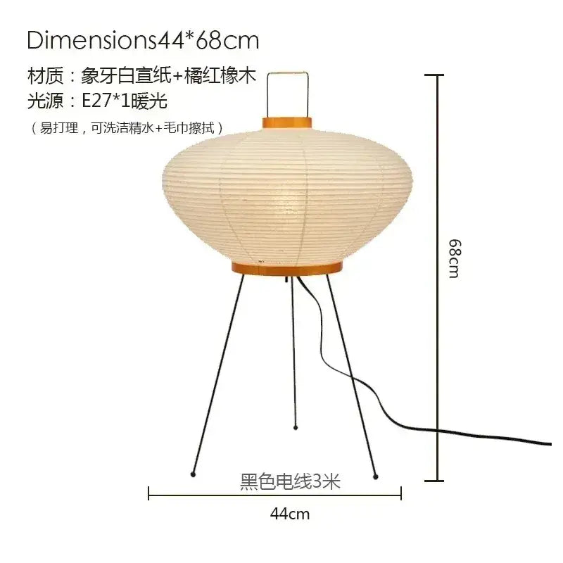 Cream-colored decorbites™ akari noguchi table lamp with rice paper shade and wooden tripod base for desk use