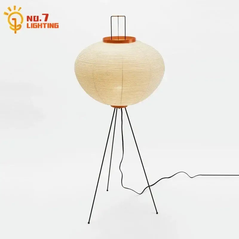 Cream-colored akari noguchi led floor lamp with black metal tripod base and wooden accents for living room decor