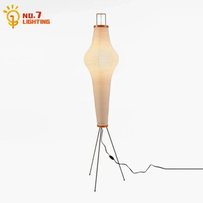 A tall slender led floor lamp with beige paper shade and black metal tripod base akari noguchi style by decorbites