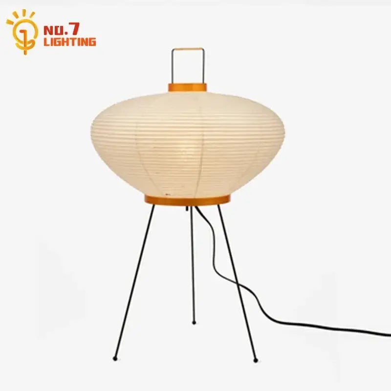 Cream-colored akari noguchi led floor lamp with gold-toned metal frame and tripod base for living room decor
