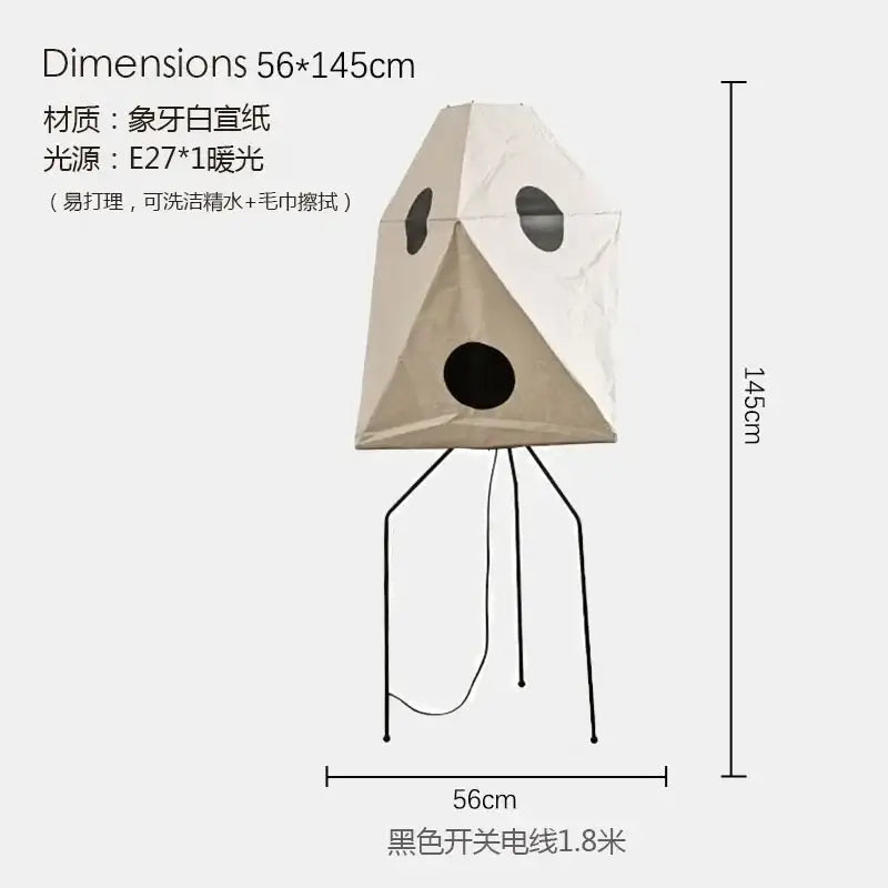 Beige paper DecorBites™ Akari Noguchi wabi-sabi led floor lamp with black circular cutouts and tripod base for living room decor