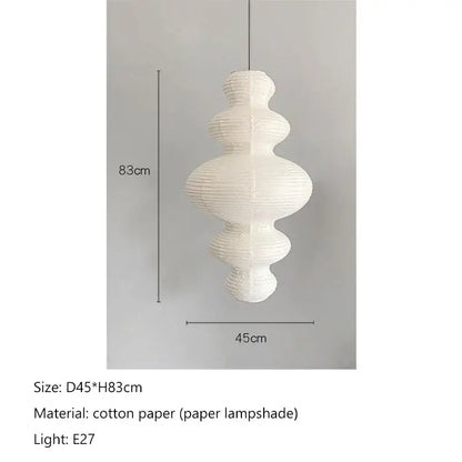 White intricately pleated cotton akari rice paper pendant lamp with tiered sculptural design for living room and bedroom