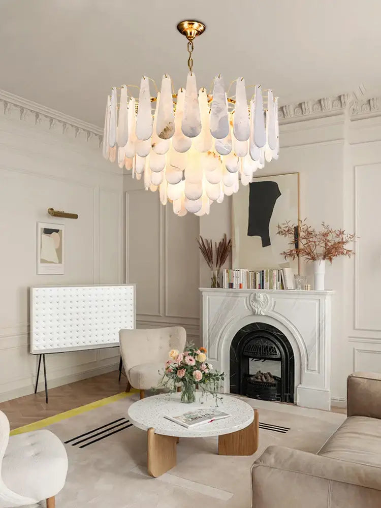 A modern decorbites alabaster lustre led chandelier with teardrop glass shades and brass fixture for dining room