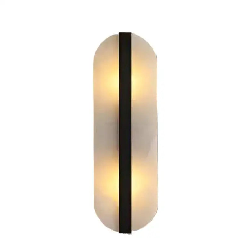 Modern oval wall lamp with frosted alabaster moon oval glass diffuser and sleek black metal accent for indoor decor