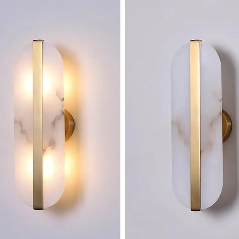 Modern wall lamp featuring alabaster oval marble diffuser and gold-toned metal frame for indoor living spaces
