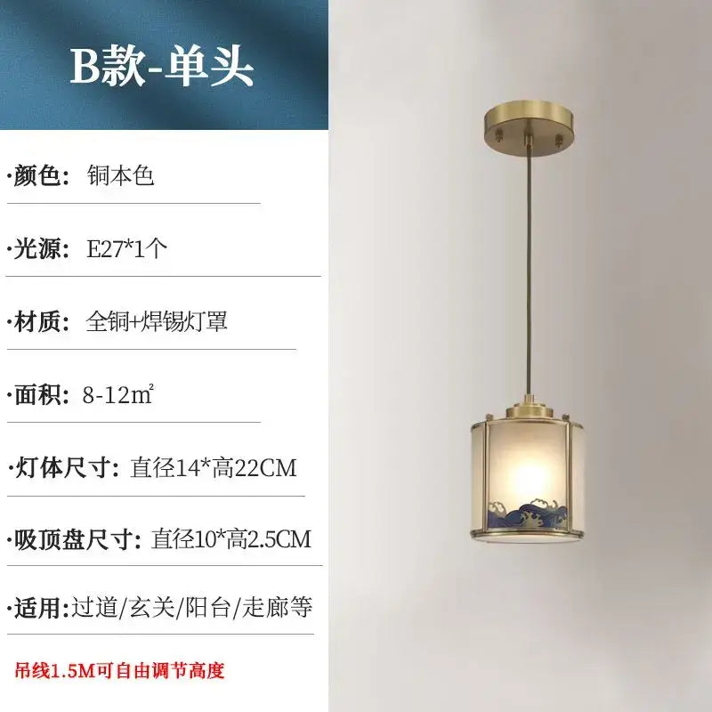 A brass-finished pendant light with a cylindrical glass shade and blue pattern for copper entrance and rotating staircase light