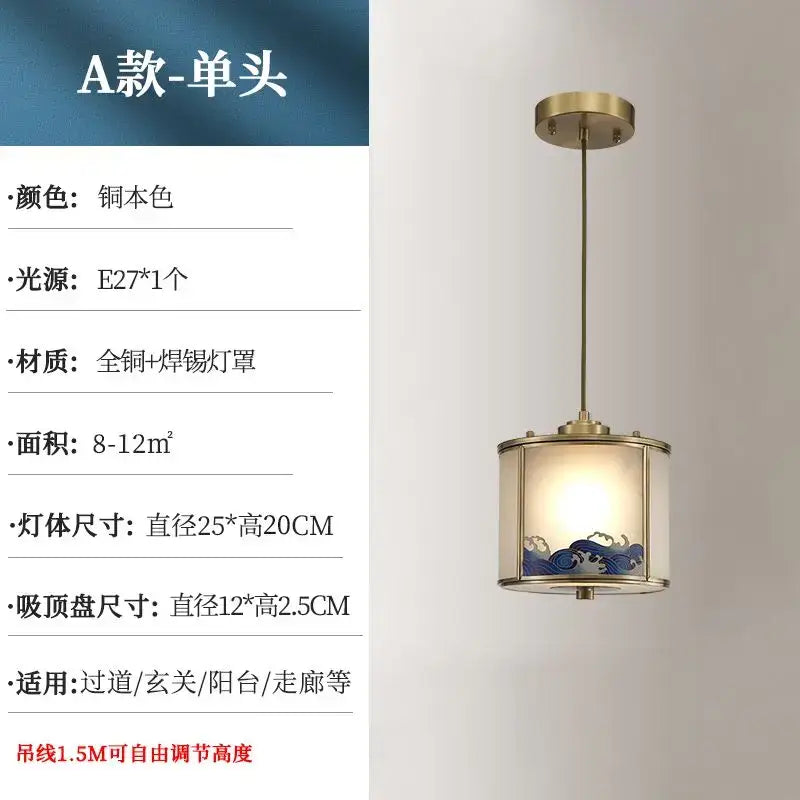 A brass-finished copper entrance pendant light with blue wave patterned glass, ideal for rotating staircase lighting
