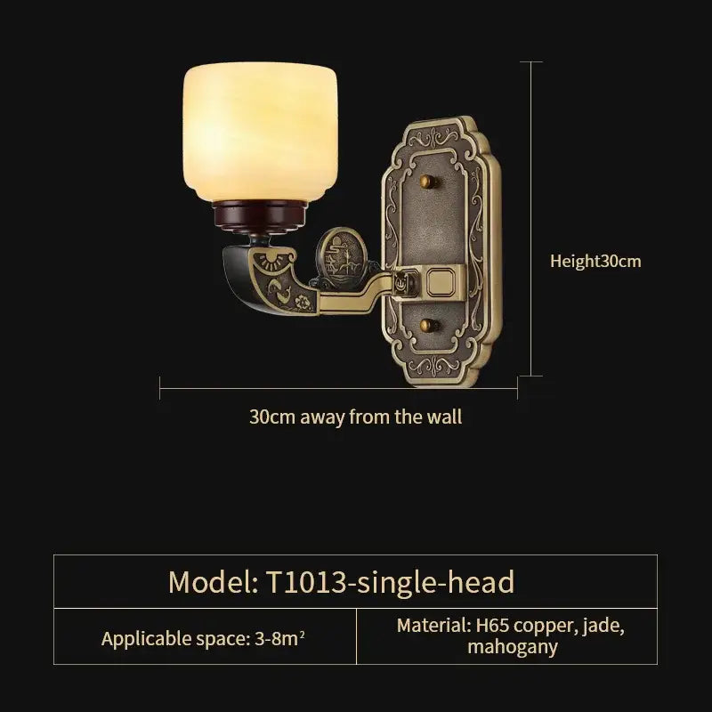 Antique-style single-head wall sconce with warm amber glass shade and ornate brass metalwork for copper jade chandelier decor