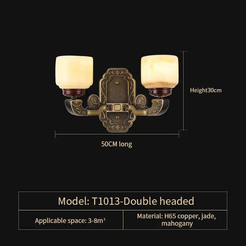 Antique brass-finished double-headed wall sconce with frosted glass shades and wood accents for copper jade chandelier decor