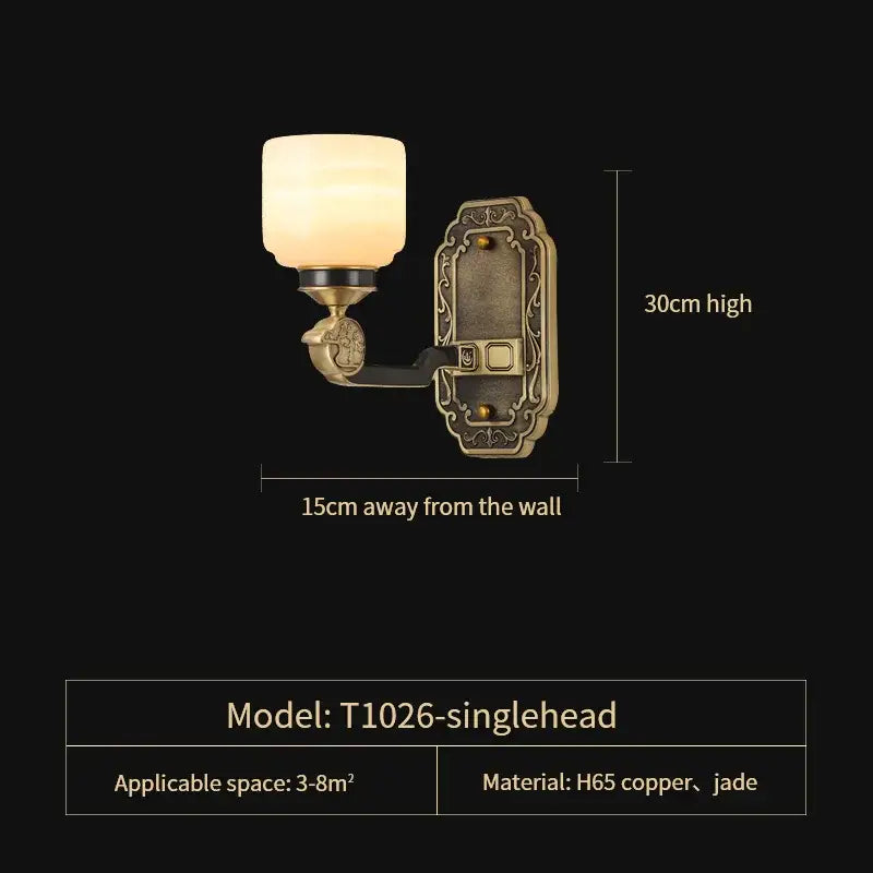 Antique brass-finished single-head wall sconce with frosted glass shade and jade accents in DecorBites copper jade chandelier
