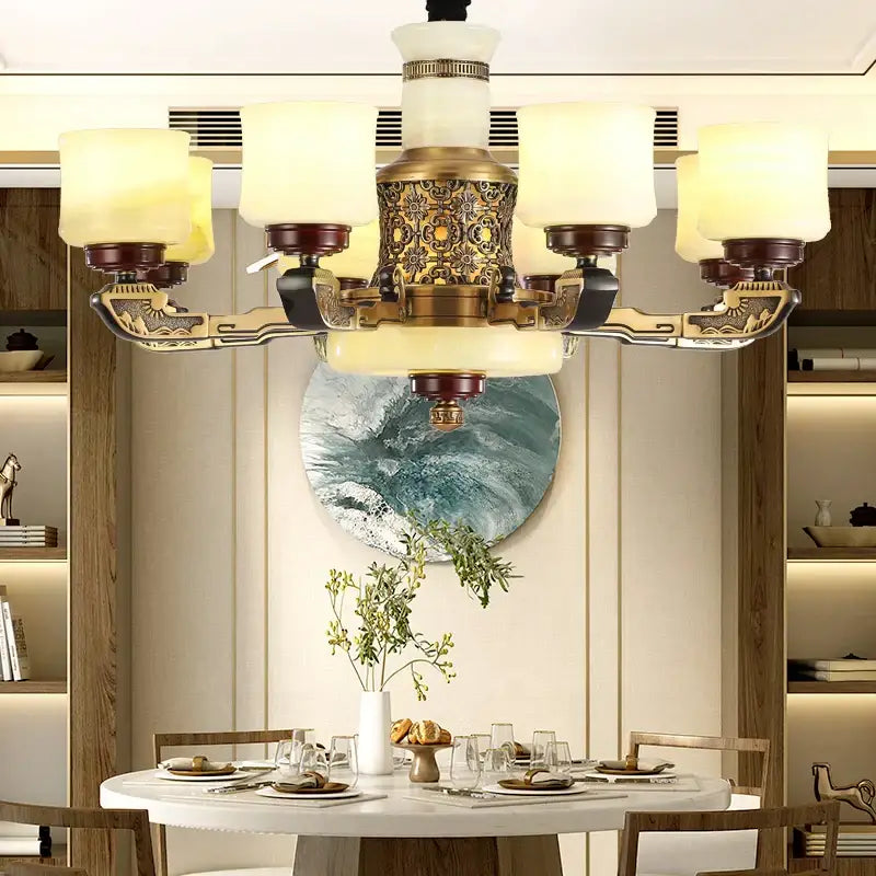 Antique brass six-light chandelier with frosted glass shades and engraved detailing in decorbites copper marble jade design