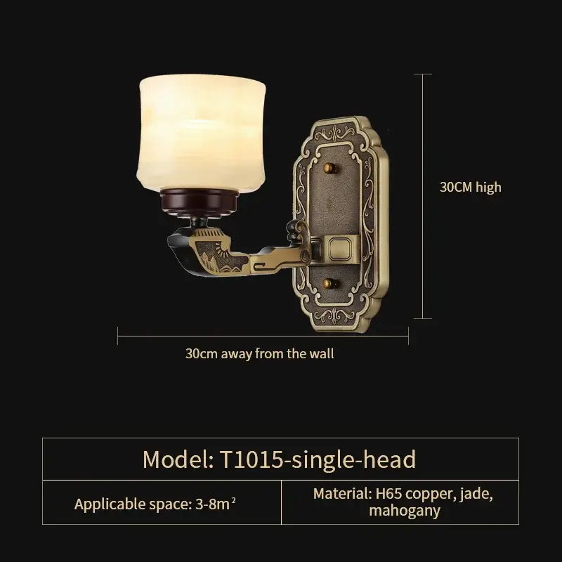 Antique brass-finished single-head wall sconce with frosted glass shade and engraved details for copper marble jade decor