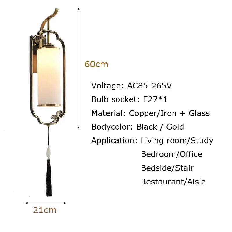 Elegant black and gold copper wall lamp with cylindrical frosted glass shade and decorative tassel for living room use
