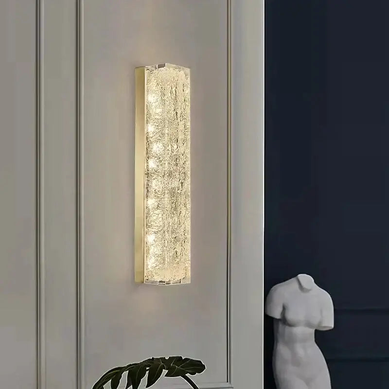 Gold-framed copper wall lamp with textured translucent glass panel diffusing warm light for light luxury decor