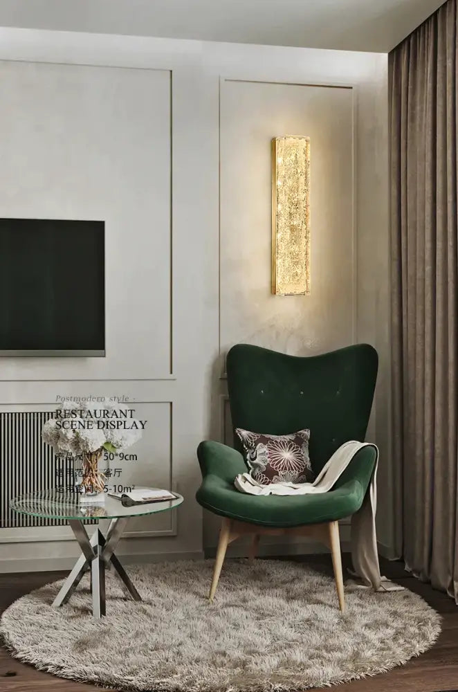 Emerald green velvet armchair with wooden legs and patterned cushion beside decorbites™ all copper wall lamp for light luxury