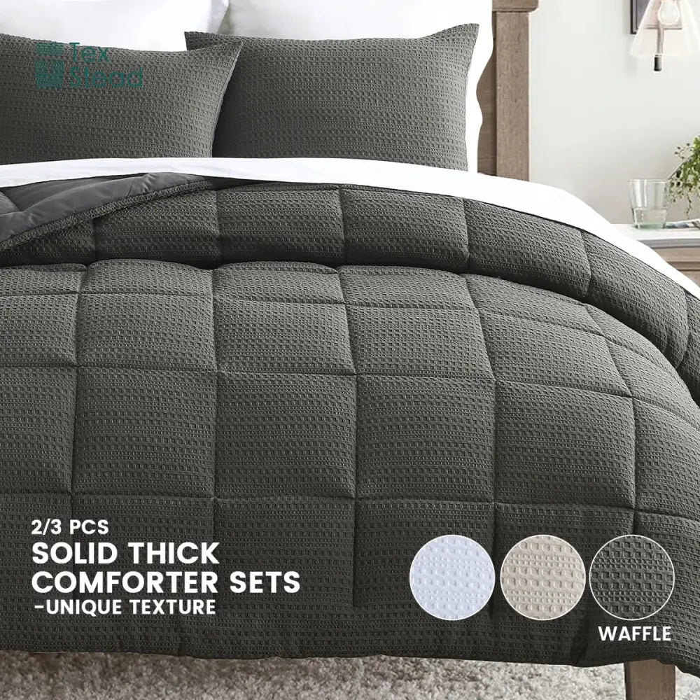 Dark gray waffle-textured decorbites™ all season bed comforter set with matching pillows for winter warmth and easy care