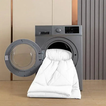 White quilted brushed duvet quilt partially inside a modern silver washing machine for all-season comfort