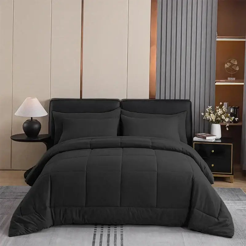 Black quilted comforter set by DecorBites with soft plush texture and subtle stitching for all-season use