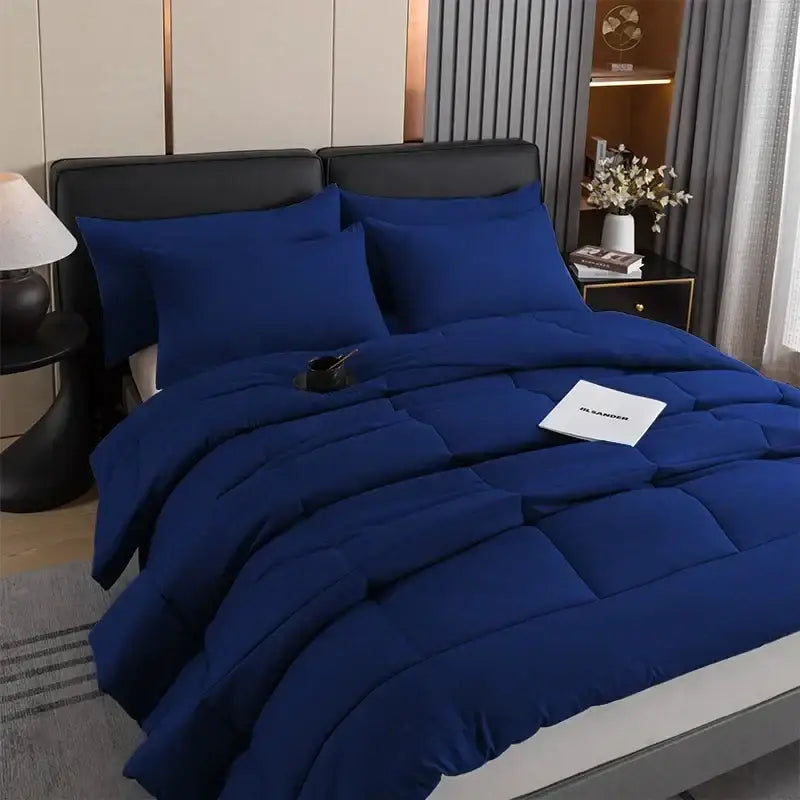 Royal blue DecorBites™ quilted duvet set with plush fabric finish and matching pillows for queen and king beds