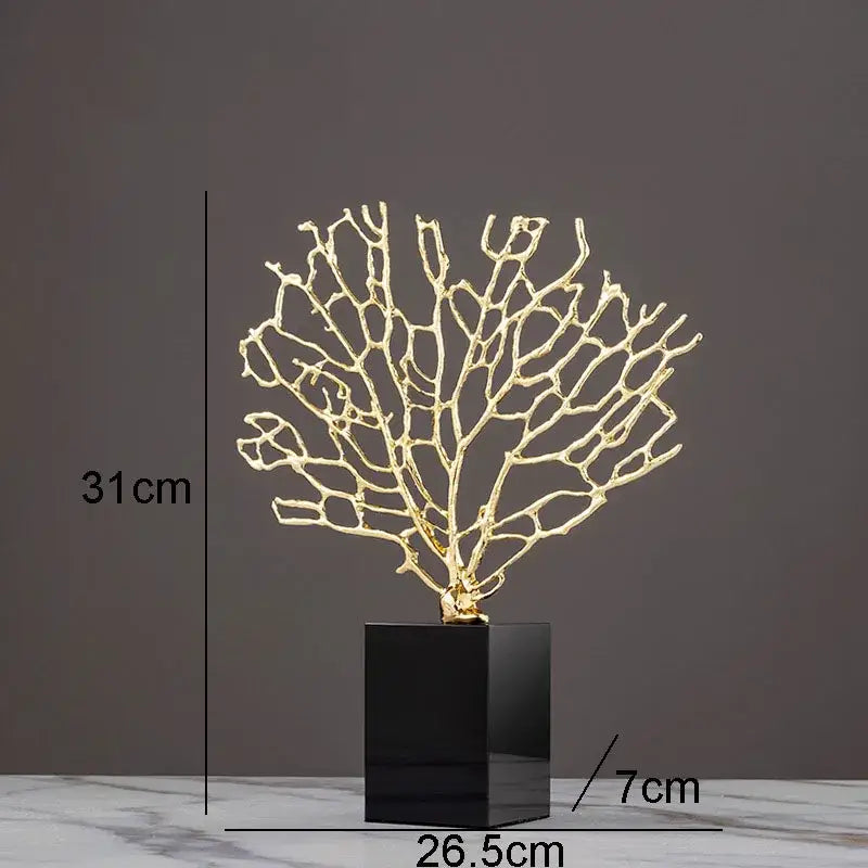 Golden alloy coral crafts with intricate branching design mounted on sleek black crystal base for stylish desktop decor
