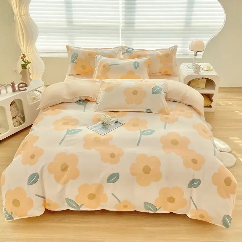 A soft cream-colored aloe cotton printed bedding set with oversized peach and muted green floral patterns for adults