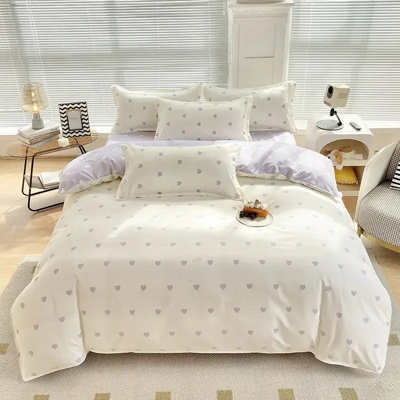 White duvet cover bedding set with subtle gray heart patterns made from aloe cotton printed fabric for adults