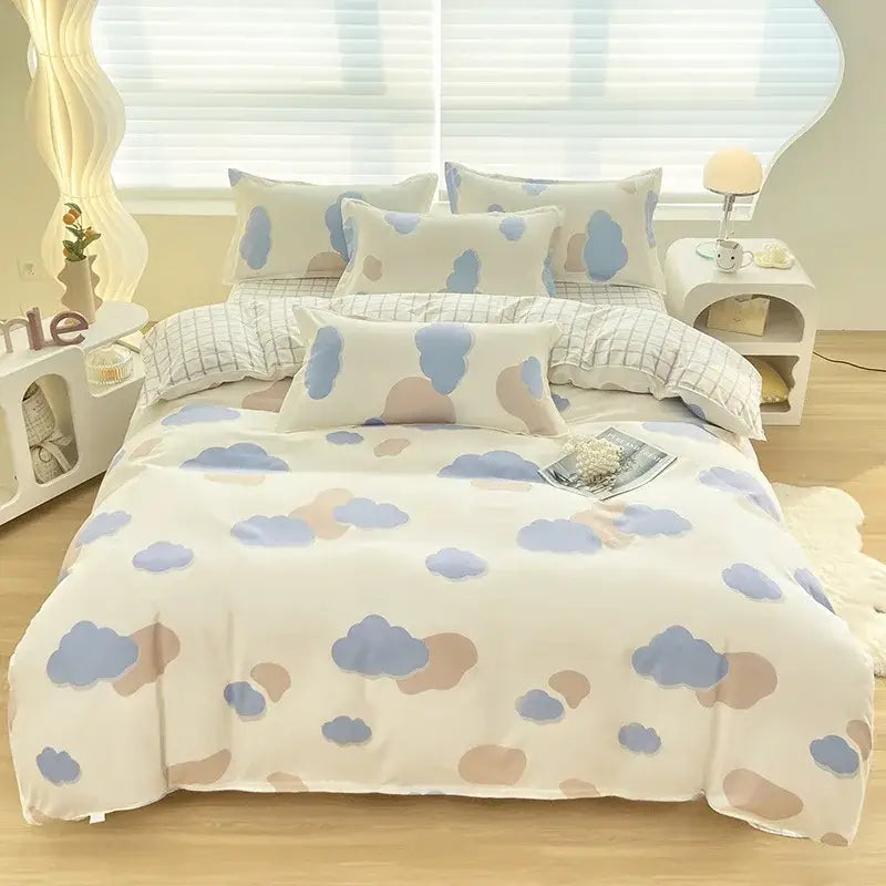 A cozy white aloe cotton printed bedding set with pastel blue and beige cloud patterns for adults by DecorBites