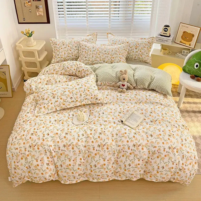 A cozy cream-colored aloe cotton printed bedding set with peach floral pattern and textured waffle weave duvet cover