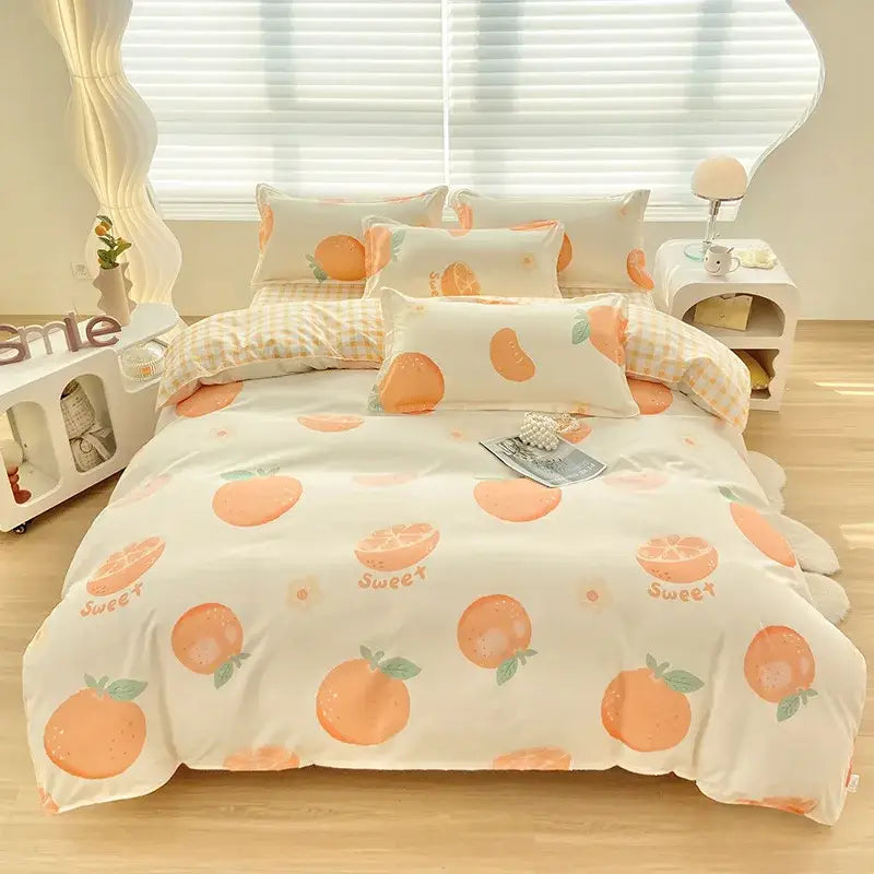Cream-colored aloe cotton printed bedding set with orange fruit pattern and sweet text in soft peach tones for adults