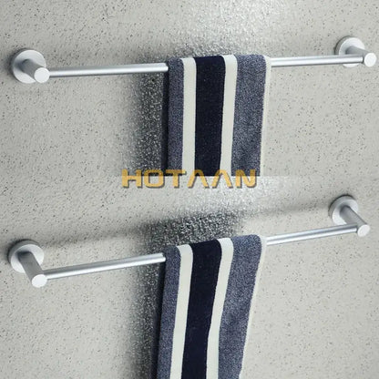 Silver aluminium DecorBites™ towel bar rail holder with two horizontal bars holding navy and white striped towels