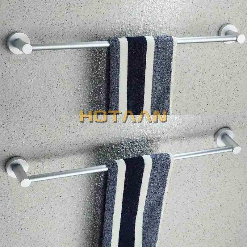 Silver aluminium DecorBites™ towel bar rail holder with two horizontal bars holding navy and white striped towels