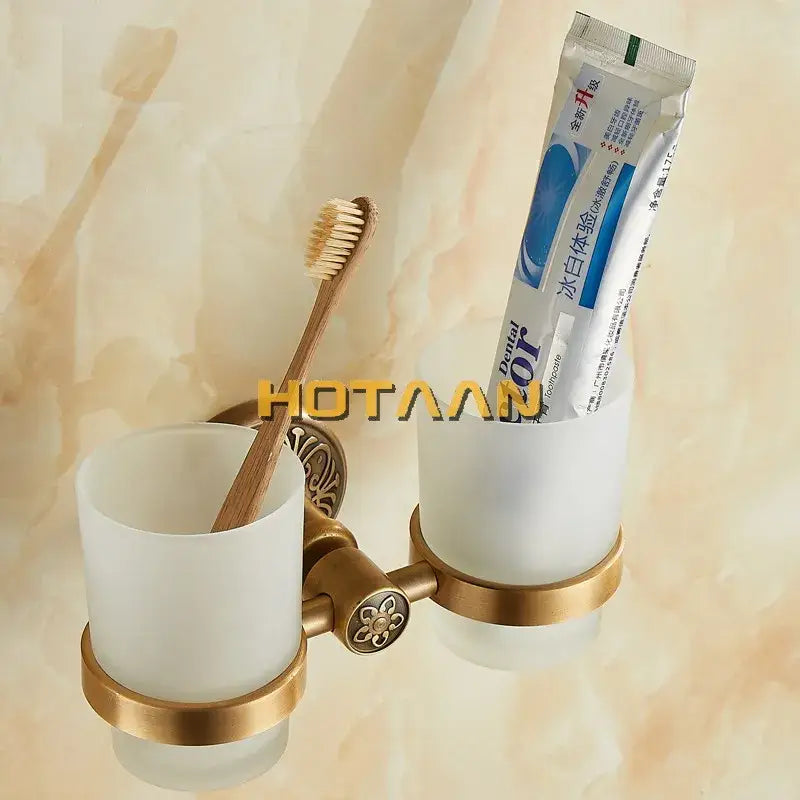 Brass-finished aluminium double tumbler holder with frosted glass cups for bathroom accessories by decorbites