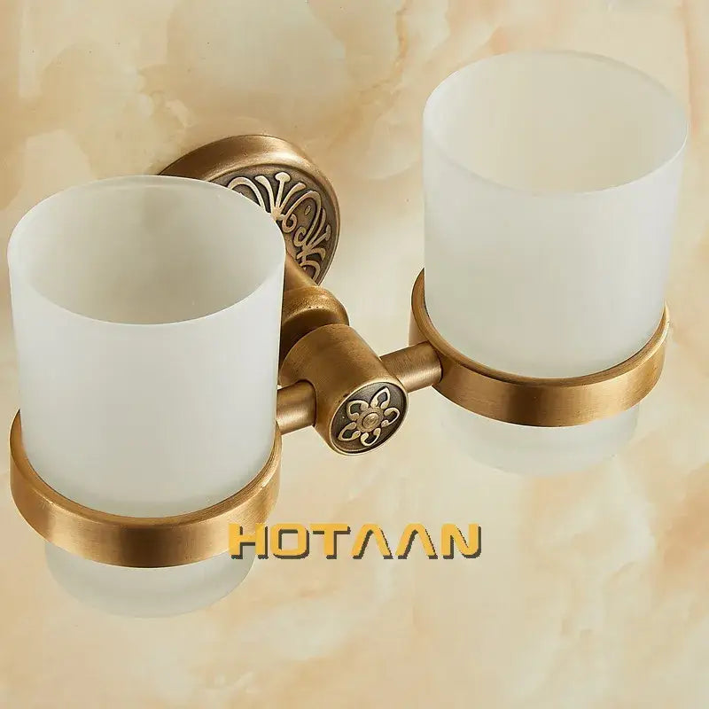 Decorbites aluminium double tumbler holder with antique brass finish frosted white glass cups and floral detailing