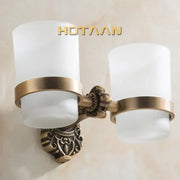 Decorbites aluminium double tumbler holder in antique brass finish with frosted glass shades for bathroom use